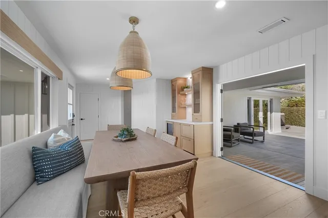 a kitchen with a table and chairs in it