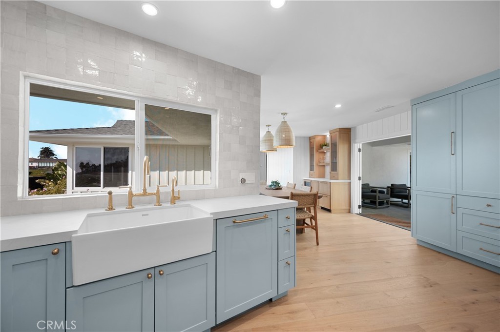 1805 Arriba Linda San Clemente, CA 92672 - Photo 20 of 50 a large white kitchen with chairs and sink