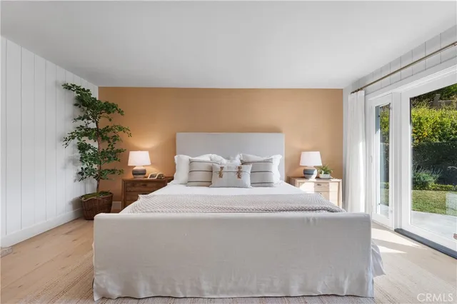 a bed room with a bed and a chair