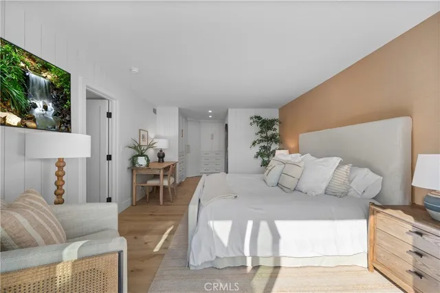 a bedroom with a bed and a table