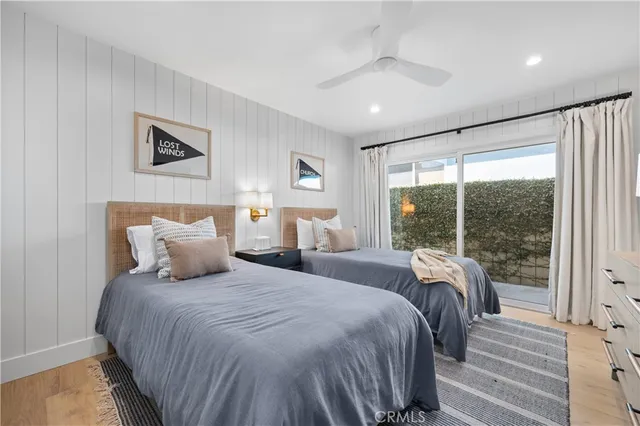 a bedroom with a large bed and a lamp