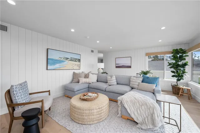 a living room with furniture and a painting