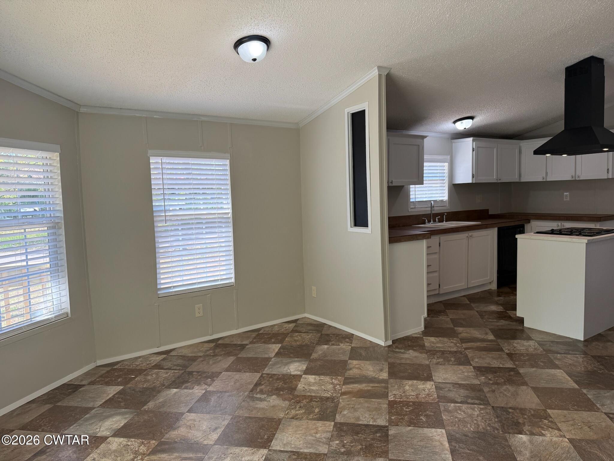 226 Massey Street Adamsville, TN 38310 - Photo 12 of 28 a kitchen with stainless steel appliances granite countertop a sink stove and refrigerator