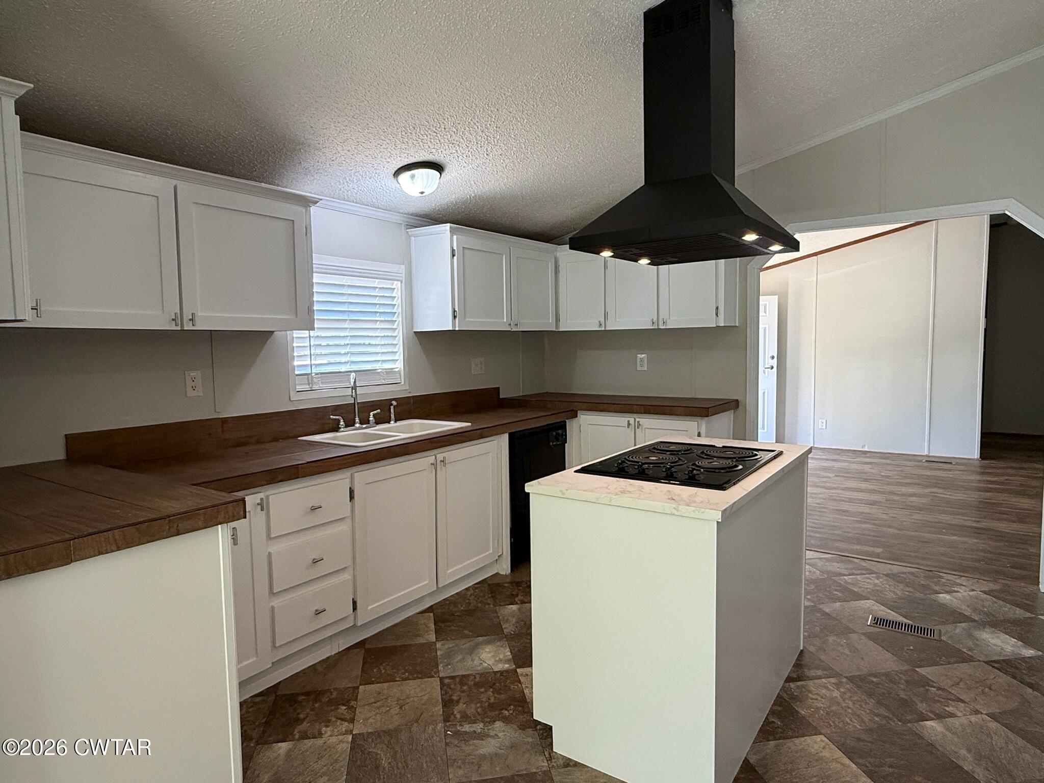 226 Massey Street Adamsville, TN 38310 - Photo 13 of 28 a kitchen with granite countertop a sink a stove and a refrigerator