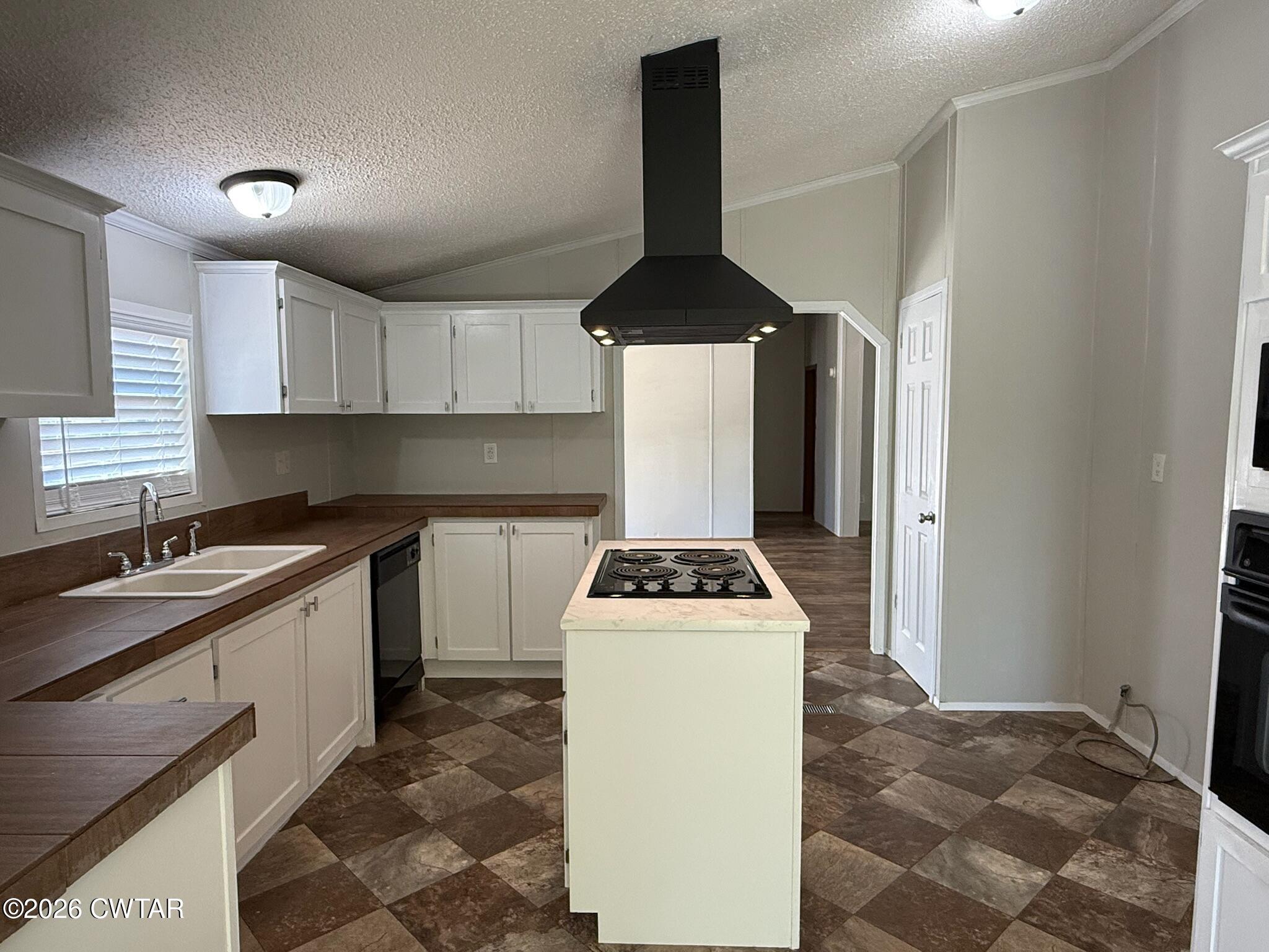 226 Massey Street Adamsville, TN 38310 - Photo 14 of 28 a kitchen with a sink a stove and cabinets