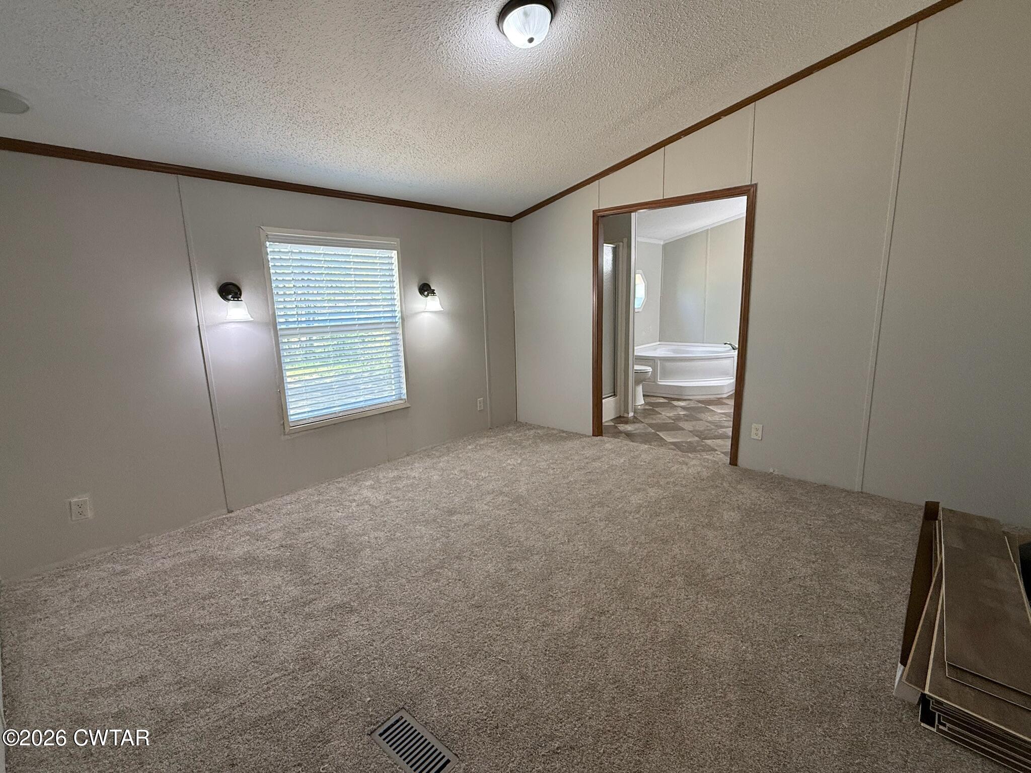 226 Massey Street Adamsville, TN 38310 - Photo 17 of 28 a view of an empty room with a window