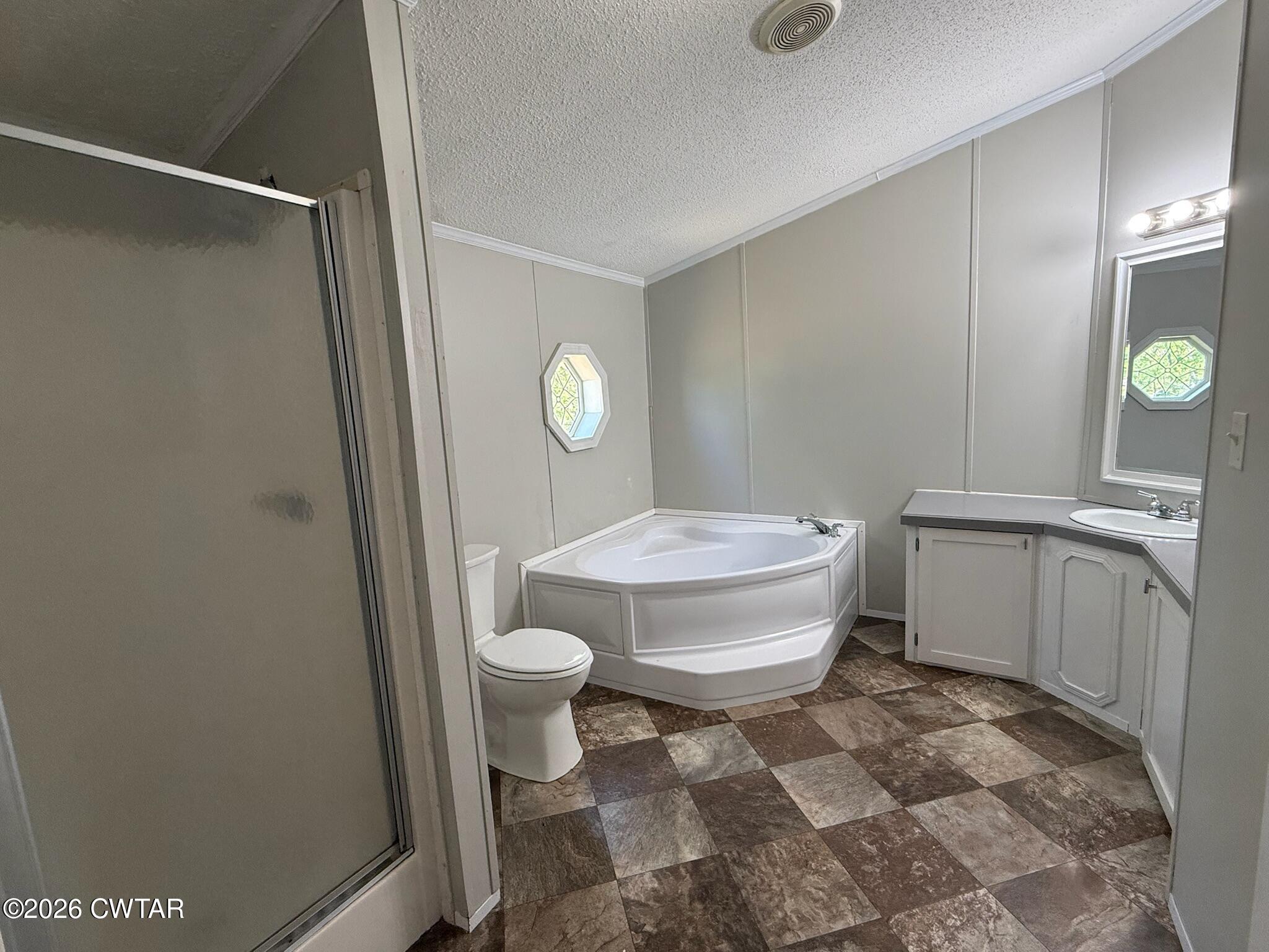226 Massey Street Adamsville, TN 38310 - Photo 18 of 28 a bathroom with a toilet and a shower
