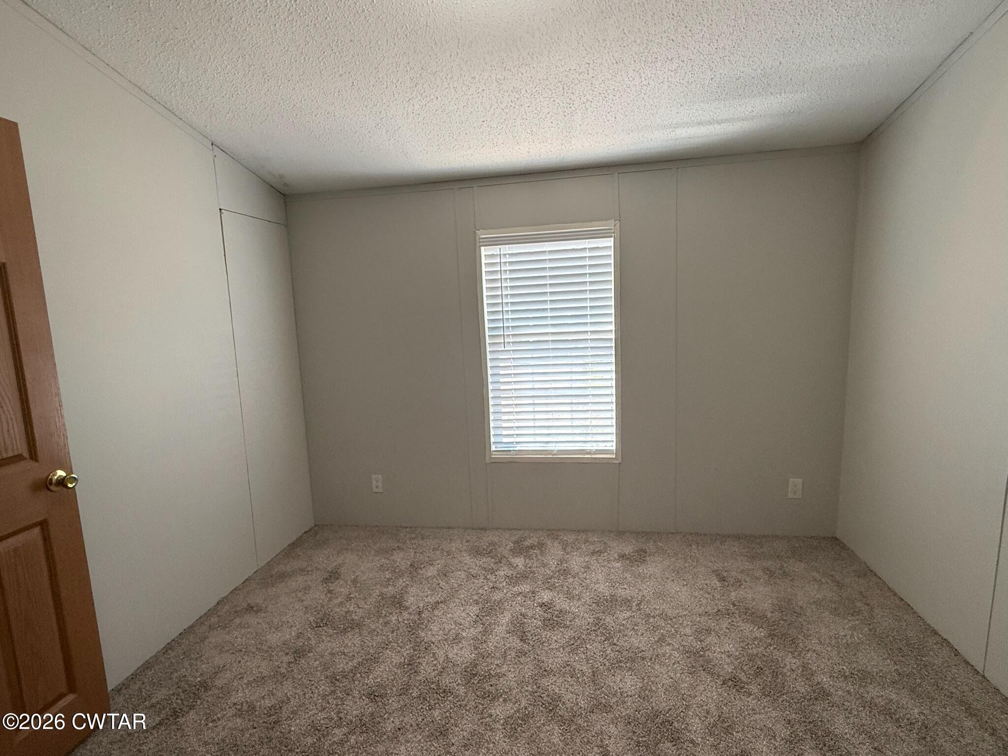226 Massey Street Adamsville, TN 38310 - Photo 19 of 28 an empty room with a window
