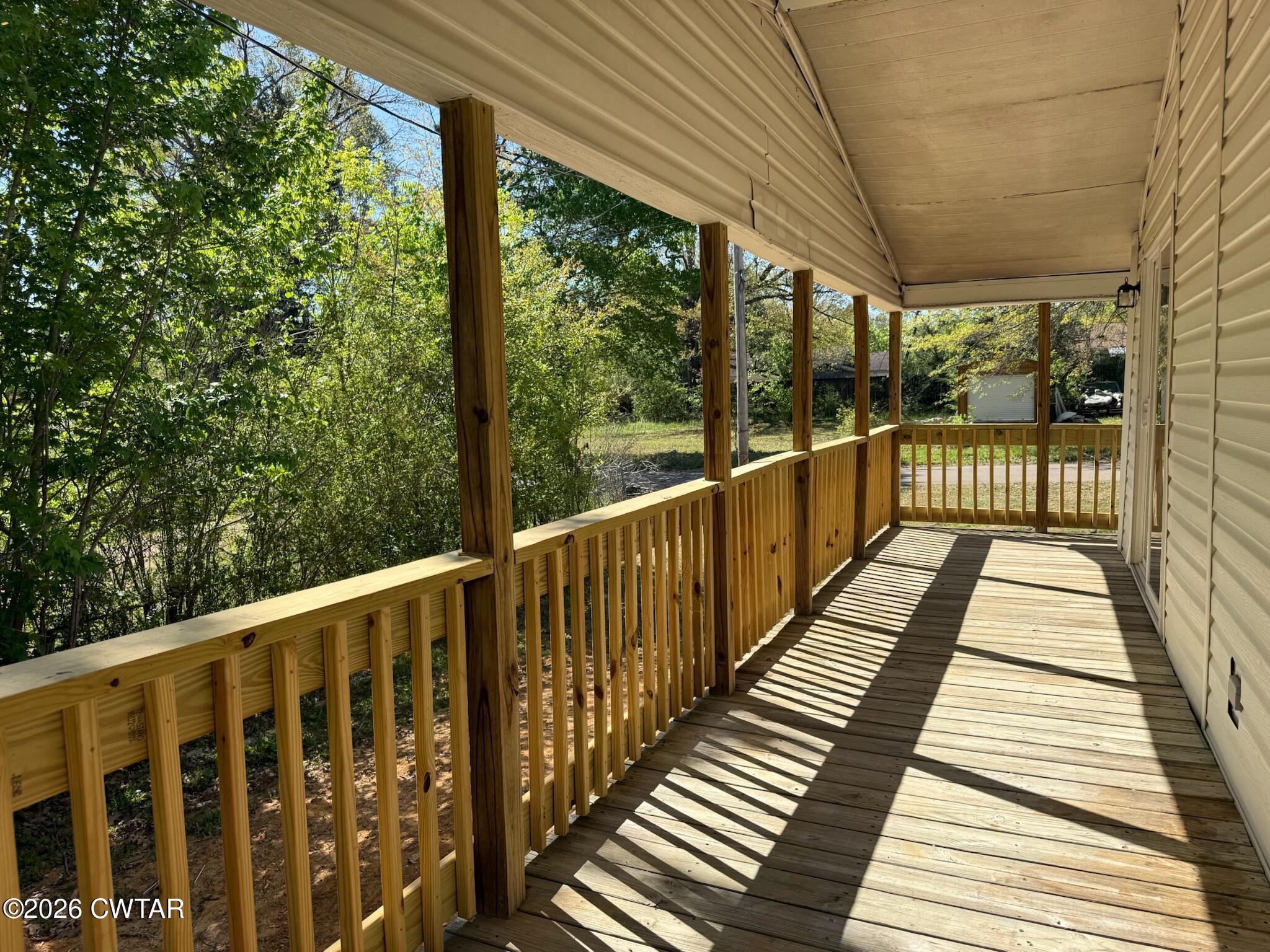 226 Massey Street Adamsville, TN 38310 - Photo 24 of 28 a view of a wooden balcony