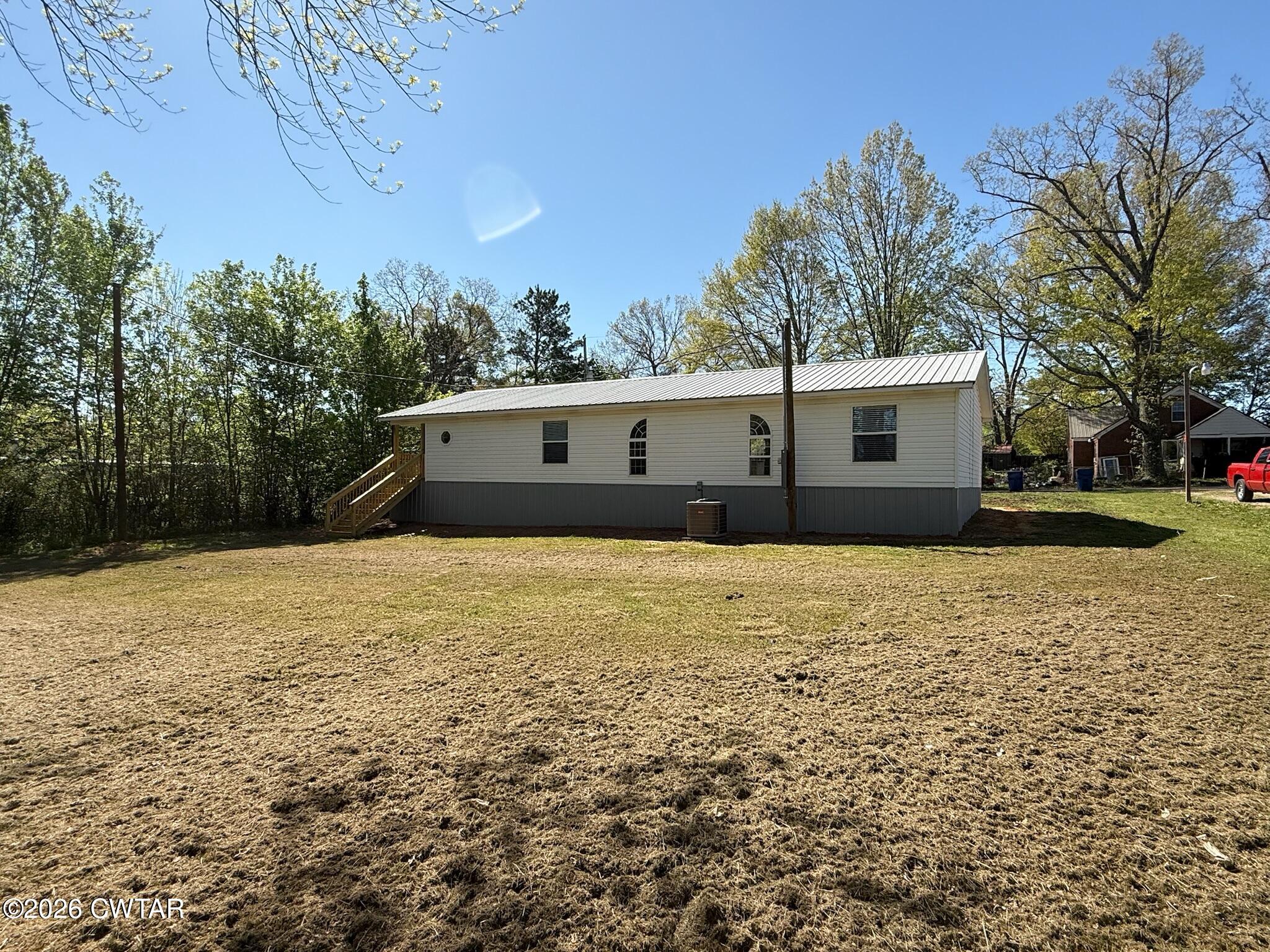 226 Massey Street Adamsville, TN 38310 - Photo 27 of 28 a front view of house with yard
