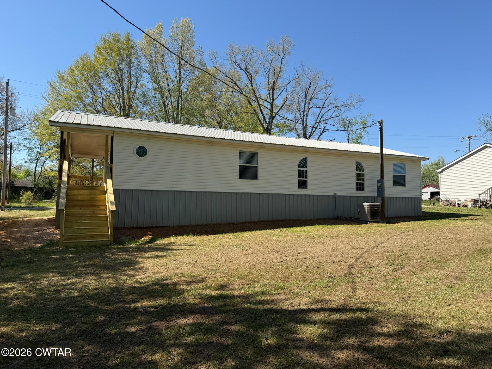 226 Massey Street Adamsville, TN 38310 - Photo 28 of 28 a view of a parking space with yard