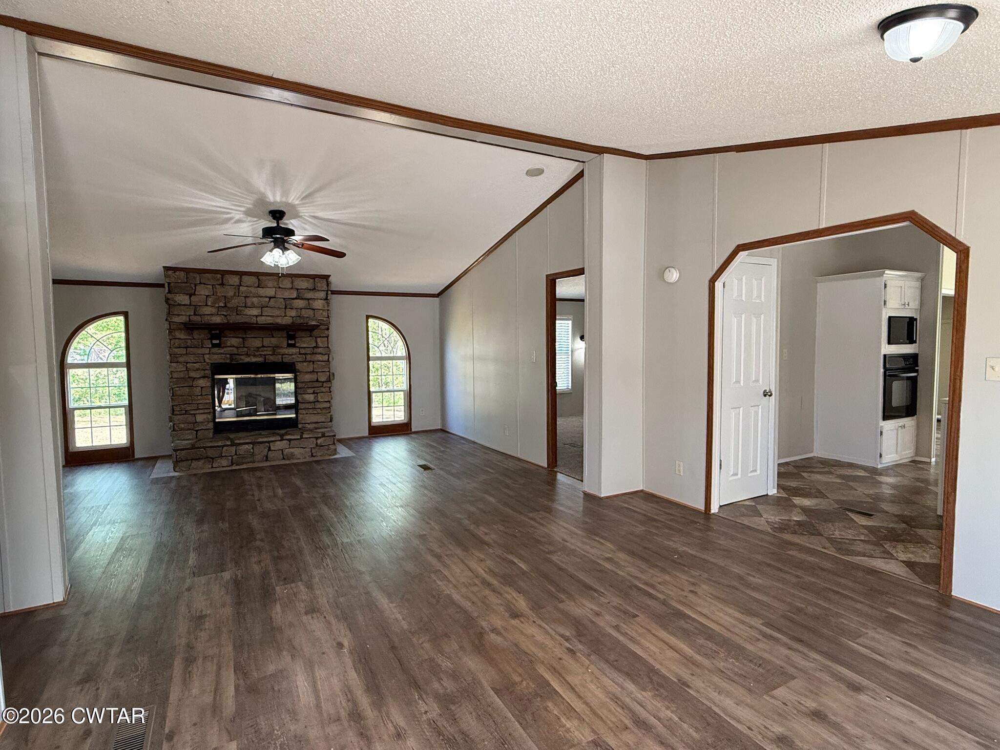 226 Massey Street Adamsville, TN 38310 - Photo 4 of 28 a view of livingroom with hardwood floor and a ceiling fan