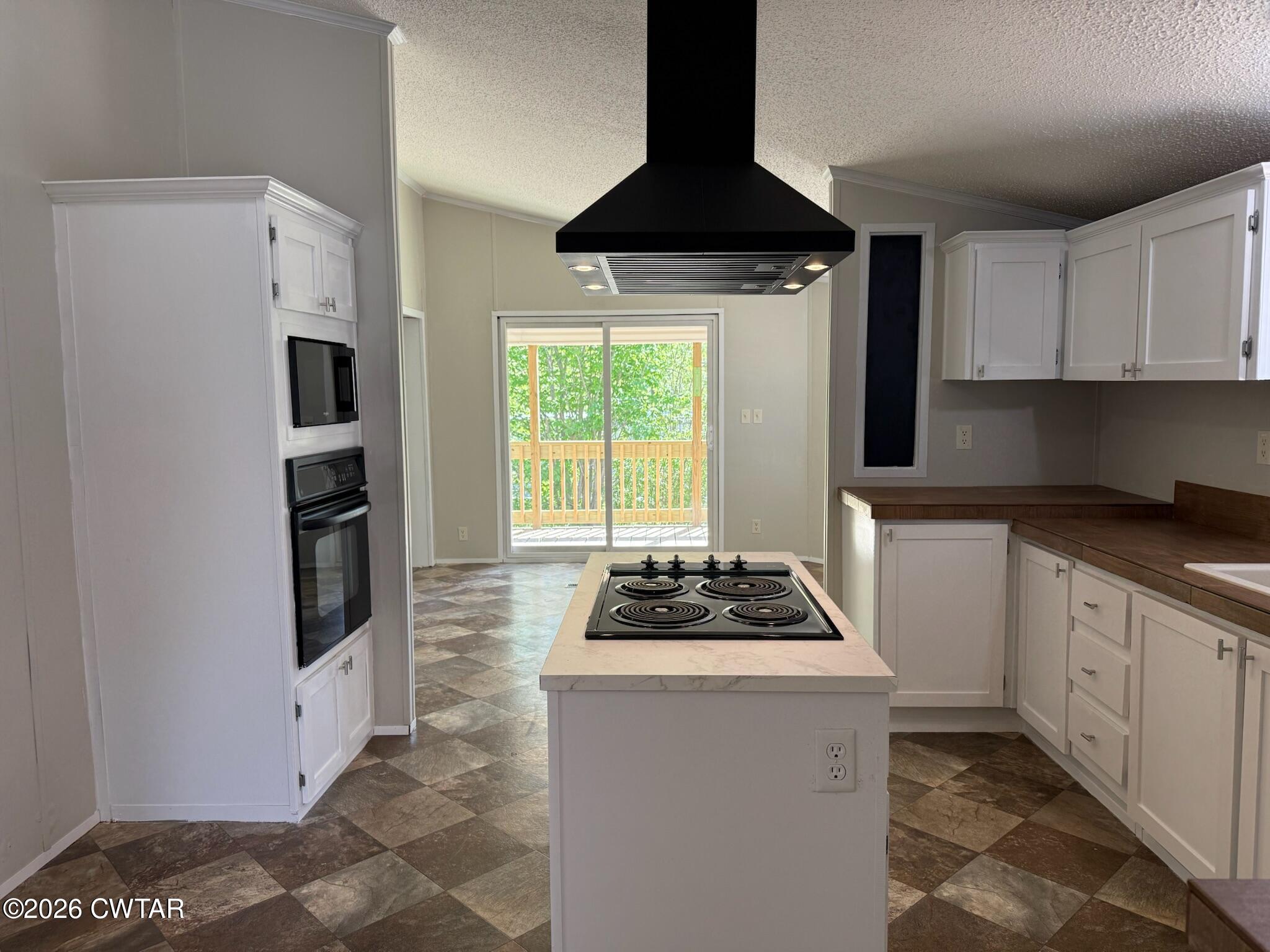 226 Massey Street Adamsville, TN 38310 - Photo 10 of 28 a kitchen with stainless steel appliances a stove a refrigerator and a stove