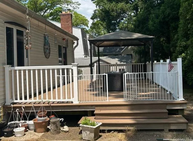 a view of a chair and tables in the balcony