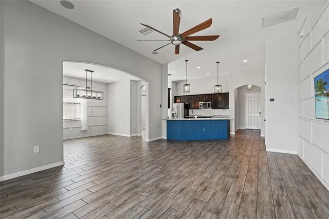 a view of kitchen with cabinets and wooden floor