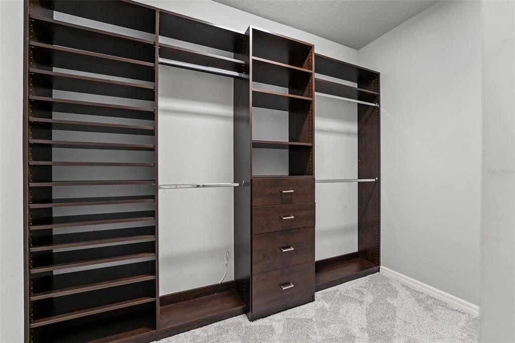 335 Old Windsor Way Spring Hill, FL 34609 - Photo 22 of 41 a view of walk in closet with empty racks