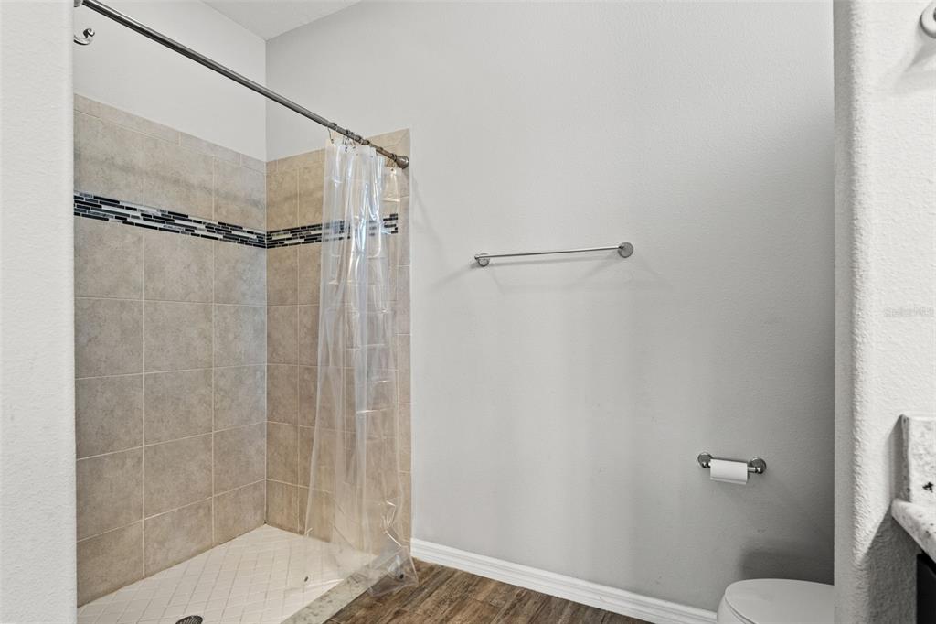 335 Old Windsor Way Spring Hill, FL 34609 - Photo 24 of 41 a bathroom with a shower and a toilet