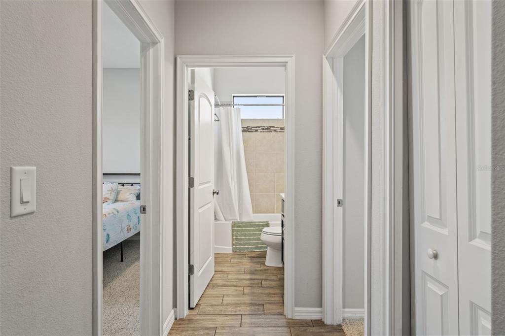 335 Old Windsor Way Spring Hill, FL 34609 - Photo 26 of 41 a view of a hallway with wooden shelves