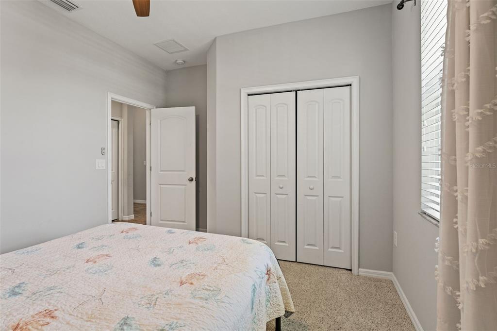335 Old Windsor Way Spring Hill, FL 34609 - Photo 27 of 41 a bedroom with a bed and a window