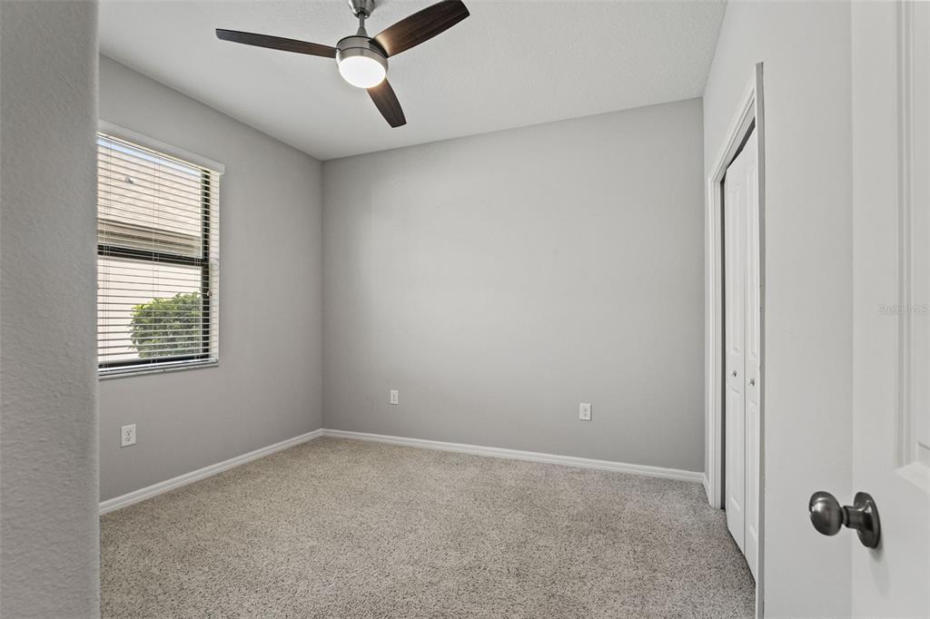 335 Old Windsor Way Spring Hill, FL 34609 - Photo 30 of 41 a view of an empty room with a window