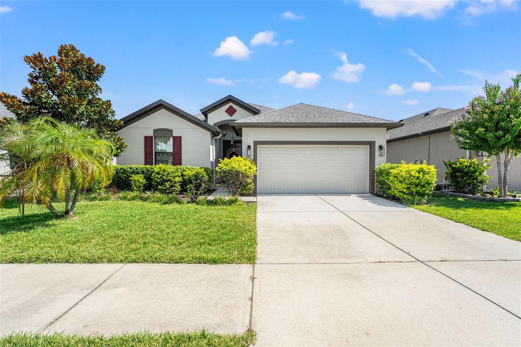 335 Old Windsor Way Spring Hill, FL 34609 - Photo 3 of 41 a view of a house with a yard