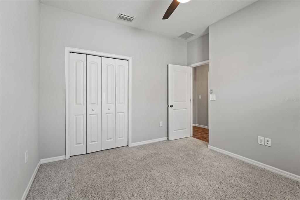 335 Old Windsor Way Spring Hill, FL 34609 - Photo 31 of 41 an empty room with closet area