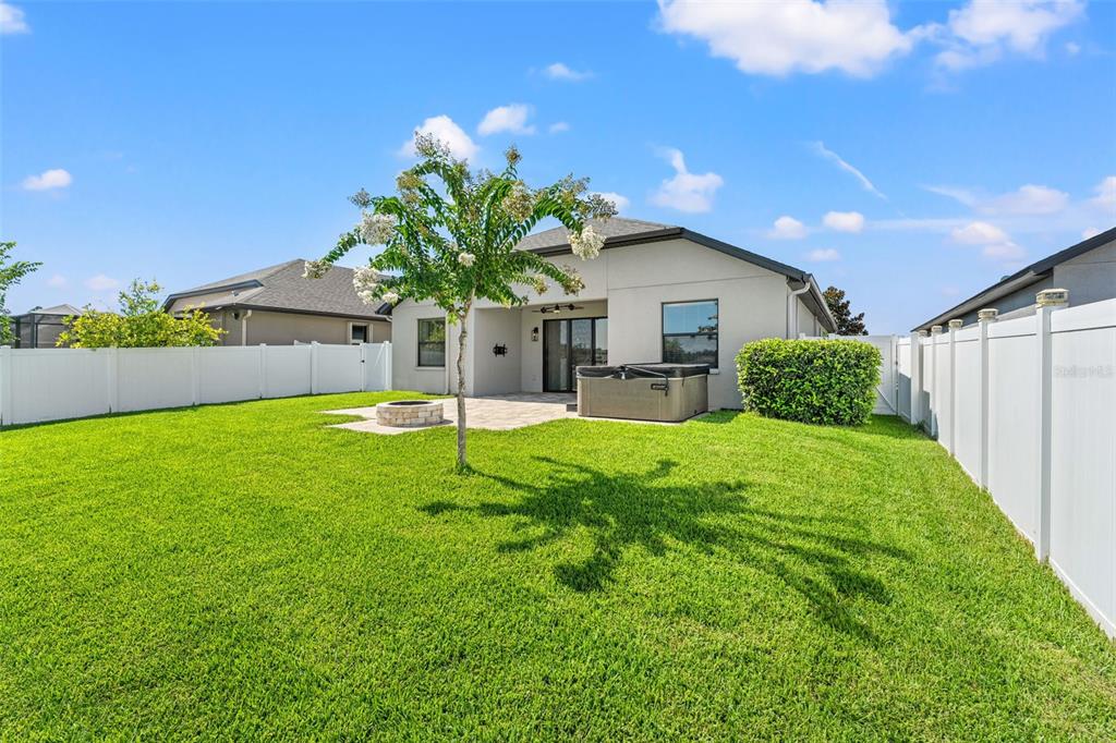 335 Old Windsor Way Spring Hill, FL 34609 - Photo 40 of 41 a house view with a garden space
