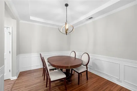 a view of dining room and wooden floor