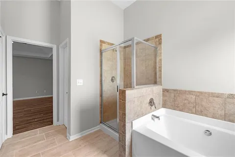 a bathroom with a tub and a sink