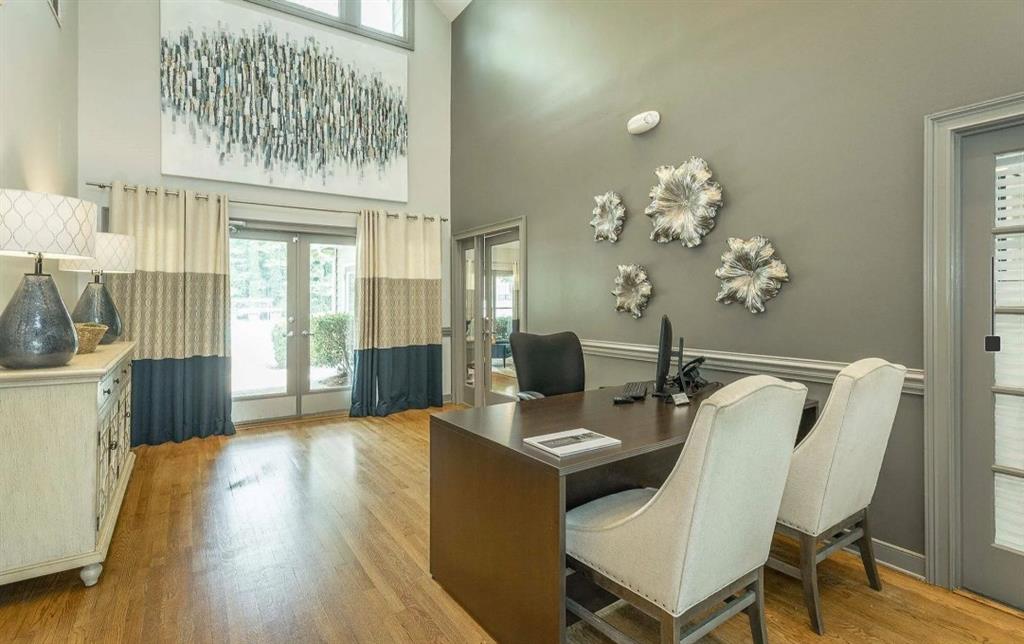 3780 Towne Crossing, Unit 511E Kennesaw, GA 30144 - Photo 12 of 12 a dining room with furniture and wooden floor
