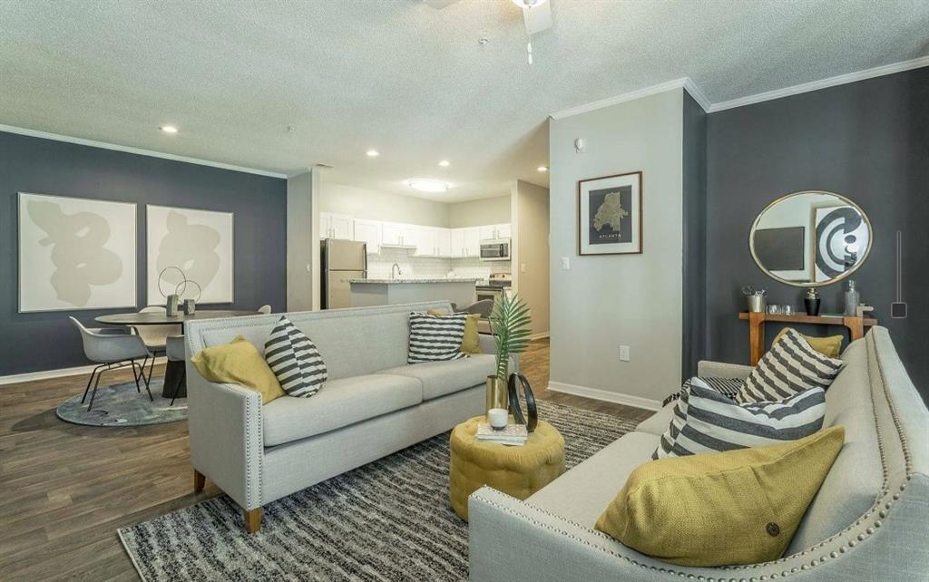 3780 Towne Crossing, Unit 511E Kennesaw, GA 30144 - Photo 4 of 12 a living room with furniture and a large window