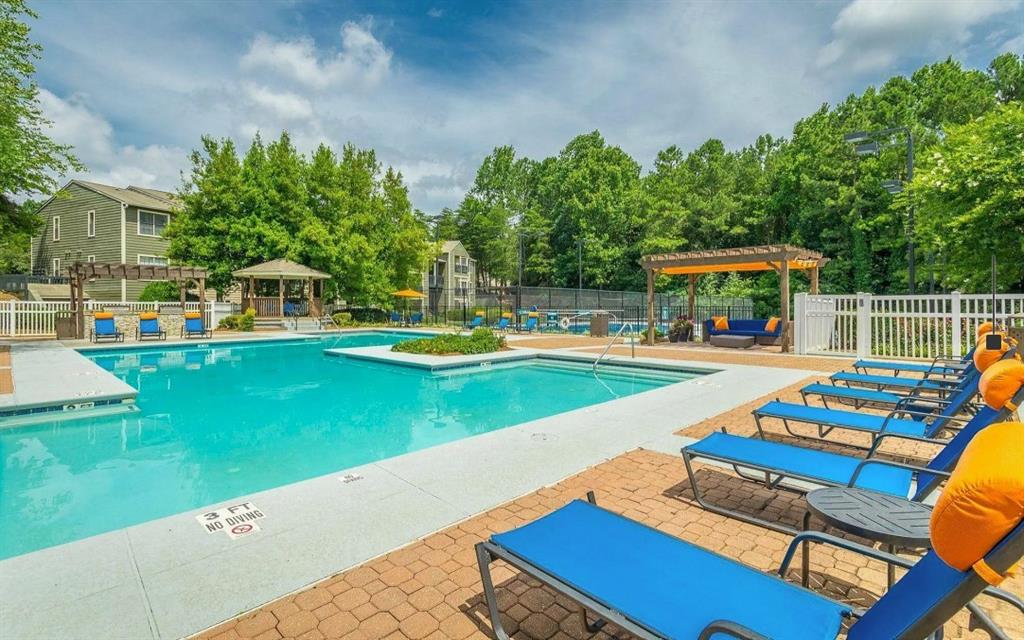 3780 Towne Crossing, Unit 511E Kennesaw, GA 30144 - Photo 9 of 12 a view of an outdoor space with a swimming pool