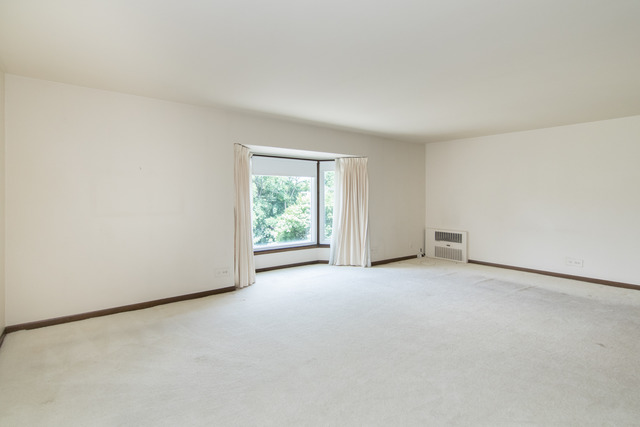 200 Thames Parkway, Unit 3G Park Ridge, IL 60068 - Photo 11 of 20 an empty room with windows