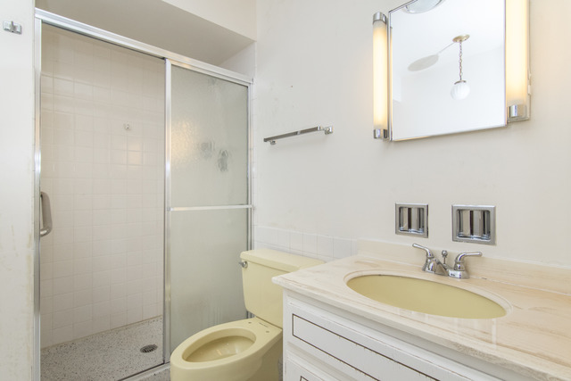 200 Thames Parkway, Unit 3G Park Ridge, IL 60068 - Photo 17 of 20 a bathroom with a granite countertop toilet sink and mirror