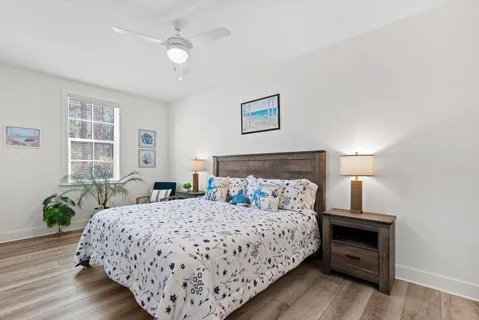 a bedroom with a bed and window