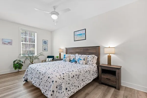 a bedroom with a bed and window