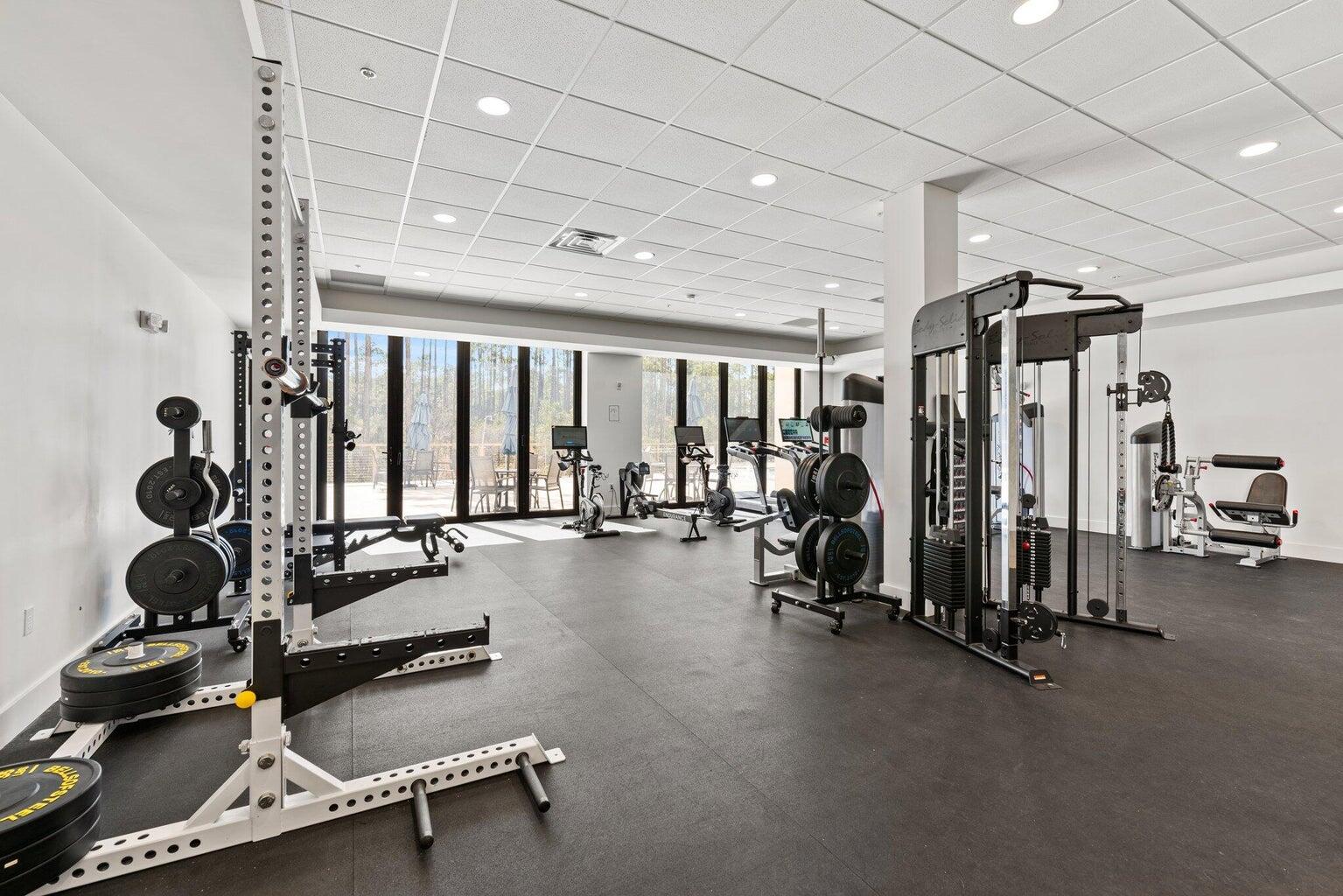 179 South County Highway 393, Unit 313 Santa Rosa Beach, FL 32459 - Photo 23 of 37 a room with gym equipment and windows