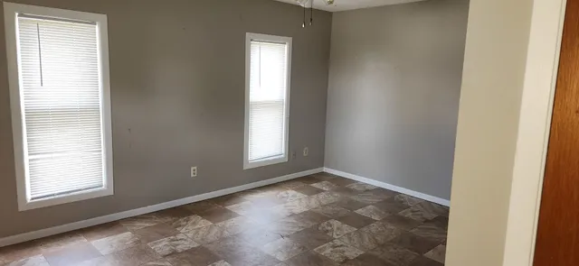 a view of an empty room and window