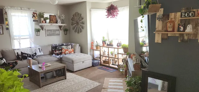 a bed room with furniture and a window