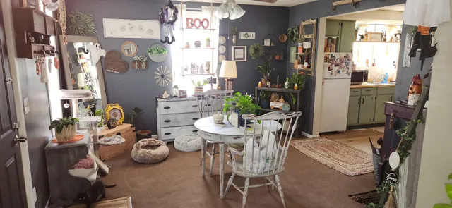 a view of a dining room with furniture and a chandelier