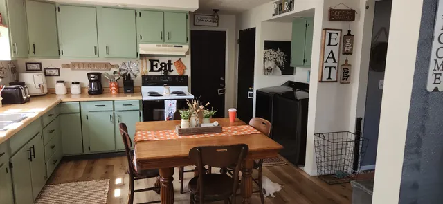 a dining room with furniture and window