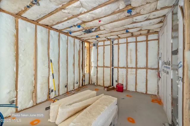a upper view of a bathroom with sink mirror and shower