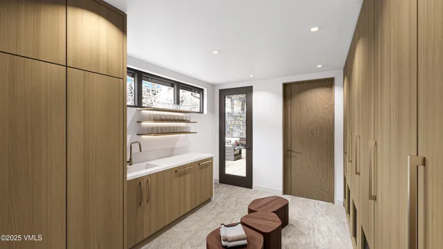 a bathroom with a tub sink and mirror