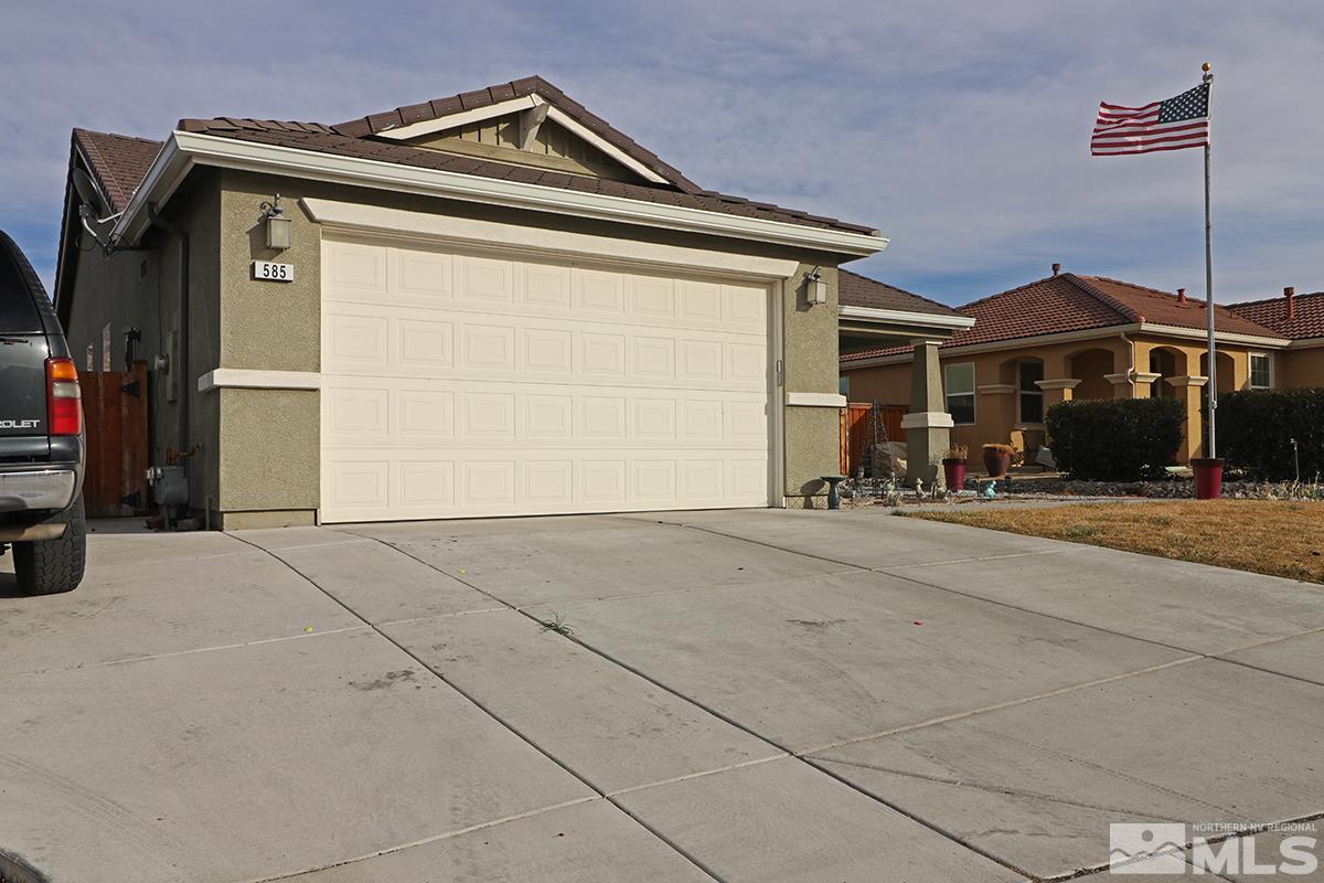 585 Verelli Court Reno, NV 89521 - Photo 3 of 18 a front view of a house with a yard