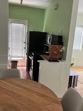 a bedroom with a bed and flat screen tv