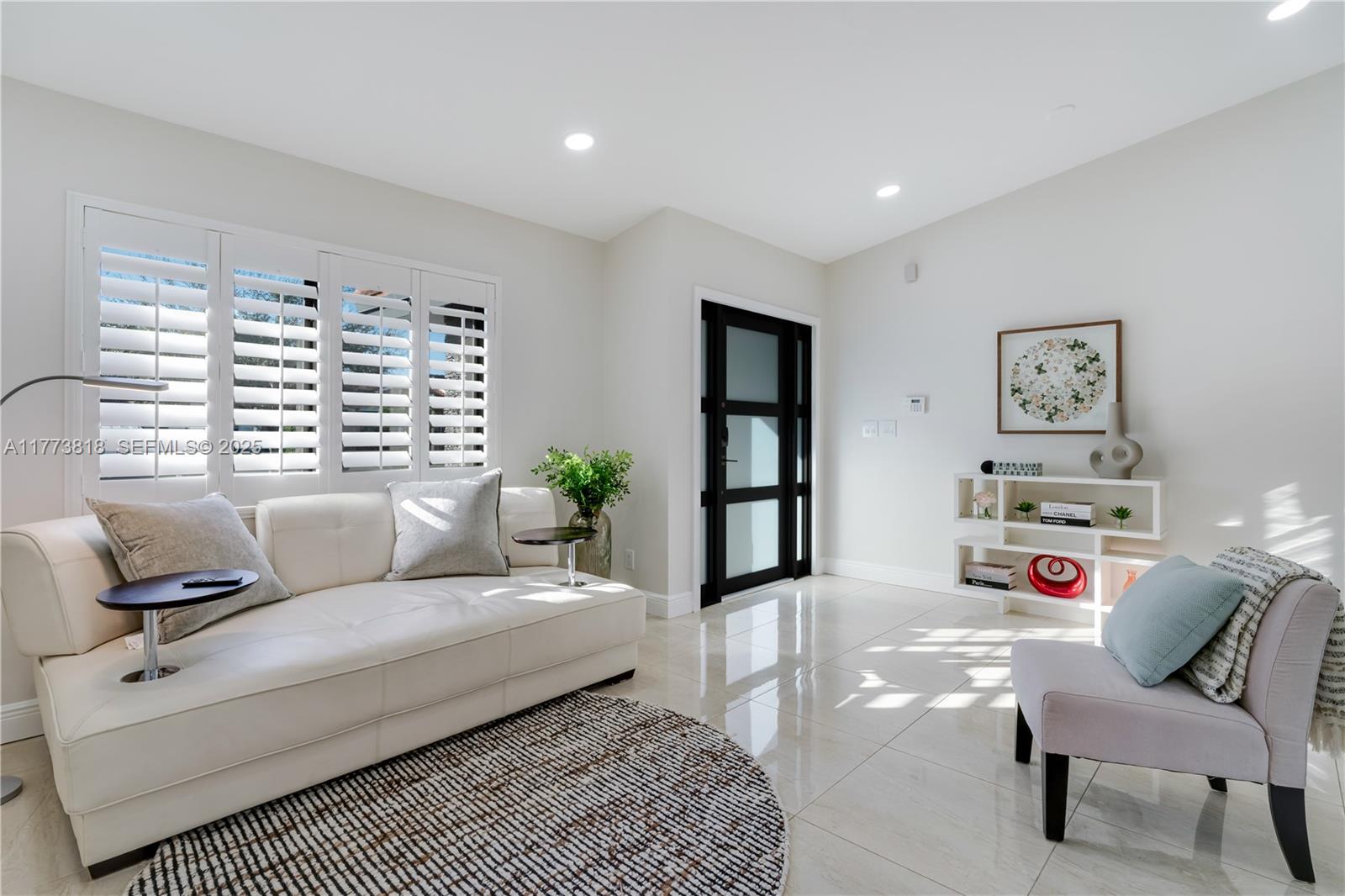 a living room with furniture and a window