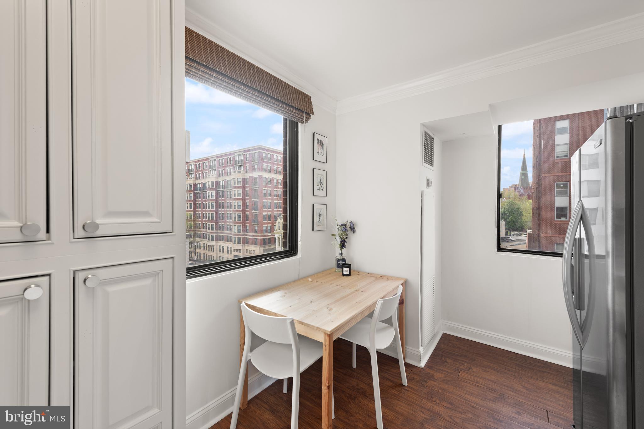 1245 13th Street Northwest, Unit 516 Washington, DC 20005 - Photo 17 of 25 a view of a dining room with furniture and wooden floor