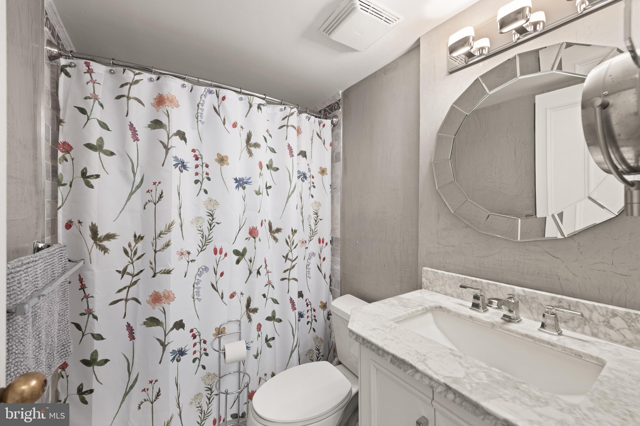 1245 13th Street Northwest, Unit 516 Washington, DC 20005 - Photo 18 of 25 a bathroom with a sink toilet and shower