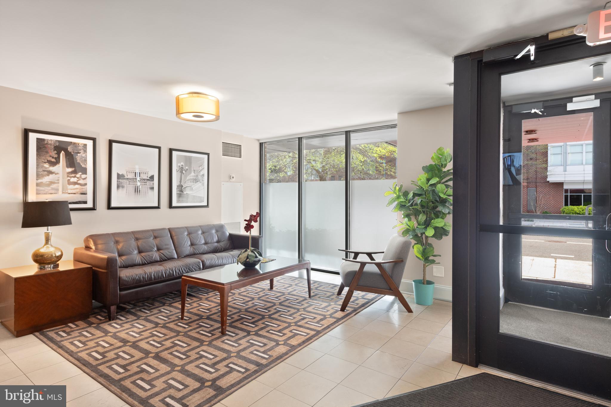 1245 13th Street Northwest, Unit 516 Washington, DC 20005 - Photo 5 of 25 a living room with furniture and a potted plant