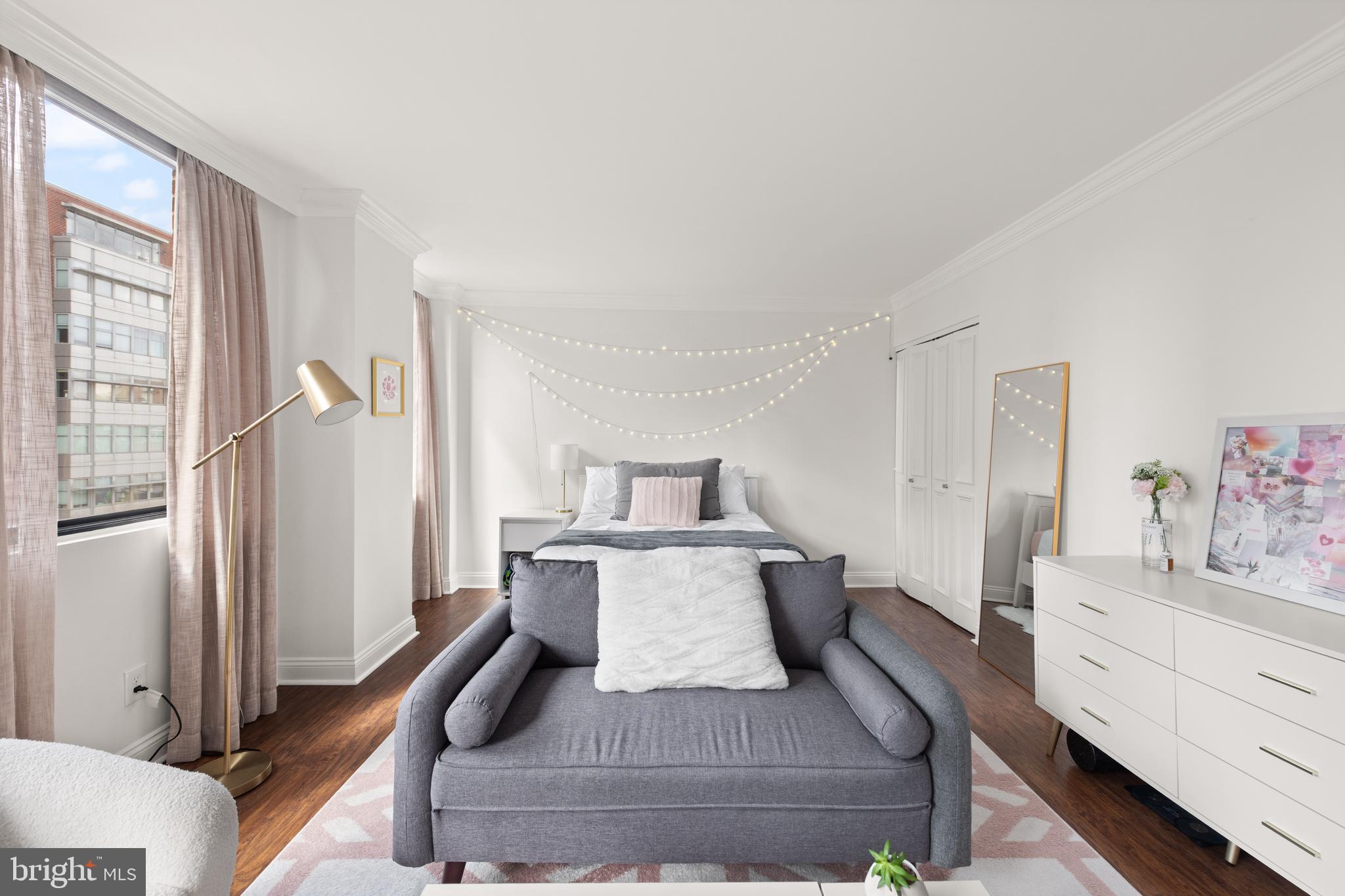 1245 13th Street Northwest, Unit 516 Washington, DC 20005 - Photo 9 of 25 a living room with furniture and a dresser
